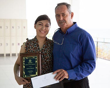 Yasmeen Mansour with White Coat Award
